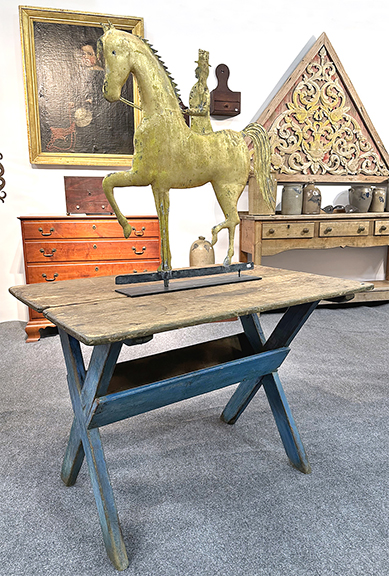 Michael Whittemore of Michael Whittemore Antiques & Folk Art, Punta Gorda, Florida, offered a scrub-top sawbuck table, the base in blue paint, 27½