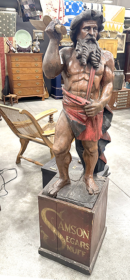 Kevin Ross of Ross & Co. Antiques, Chillicothe, Ohio, had the most diverse offerings on the floor, ranging from a three-dimensional violin trade sign made of metal to a Black Forest hall tree featuring mountain goats to floor-standing harps. “We have everything from Fabergé to Americana,” said Ross. Oddities included a cigar-store figure of a muscular Samson with a raised sword, advertising “Samson Segars Snuff,” one side lettered “Fine Tobacco / Importers / Delos & Larke / E. Liverpool, O.,” the opposite side with a tobacco leaf. It stands 67