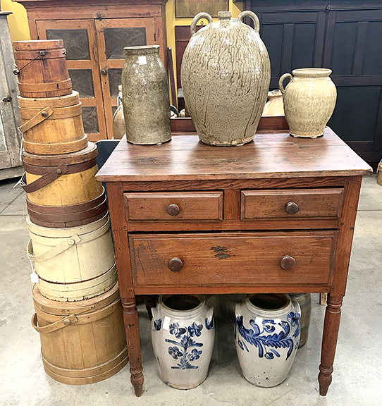 Southern furniture offered by Jim Hewitt of James Hewitt Antiques, Woodstock, Georgia, included an Alabama server in pine, priced at $3595. Measuring 36