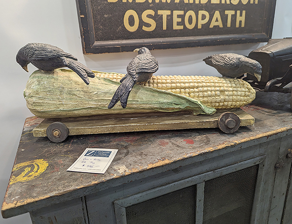 This carved wooden pull toy of crows on corn was priced at $395 by Ziebarth’s Antiques & Auctions.