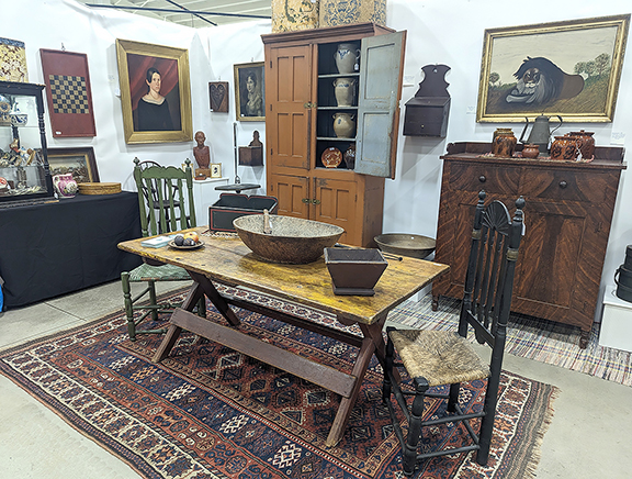 Great pieces were in sight no matter which way one turned in the dealer space of Nancy and Gene Pratt of Victor, New York. Among their offerings were a decorated Pennsylvania cupboard in walnut and poplar with a gallery top ($2150); a folk-art lion painting ($1750); a Hudson Valley wall box with a drawer, in original condition and with old paint, circa 1810 ($1350); redware, including a handled pot with a lid ($475); a wrigglework coffeepot with a tulip design, Pennsylvania, circa 1840 ($1395); and a four-door cupboard, New York state, circa 1850 ($2150).