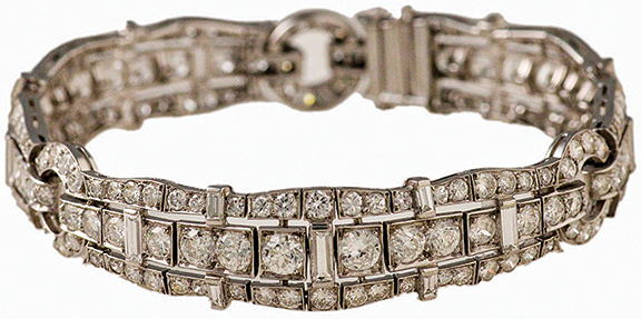 Art Deco platinum and diamond bracelet, with multiple graduated bead-set diamonds and baguette diamonds, 7