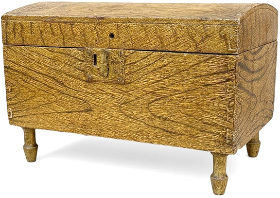 It is not surprising that these two dome-lid boxes display very similar bold grain-painted surfaces. Both feature dovetail construction and began life in the early 19th century. At some point in the 20th century the boxes came into the possession of Jacob G. Kibler, who lived in the area of New Market/Woodstock, Virginia, and is known for decoratively painting reclaimed furniture. These boxes were painted as gifts for Kibler’s daughters, Maud and Mattie. The smaller box, 12
