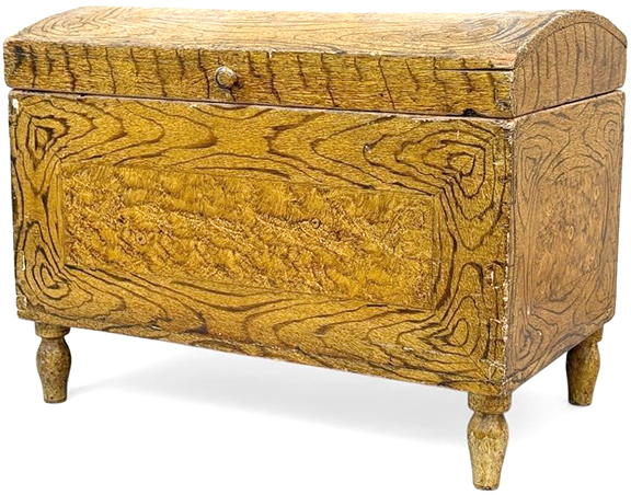 It is not surprising that these two dome-lid boxes display very similar bold grain-painted surfaces. Both feature dovetail construction and began life in the early 19th century. At some point in the 20th century the boxes came into the possession of Jacob G. Kibler, who lived in the area of New Market/Woodstock, Virginia, and is known for decoratively painting reclaimed furniture. These boxes were painted as gifts for Kibler’s daughters, Maud and Mattie. The smaller box, 12
