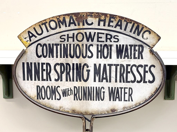 What more could a weary traveler ask? The double-sided lollipop sign likely invited people to stop at a hotel, motel, or guest cabin. It is an example of early 20th-century repurposing. The sign was originally a familiar black-lettered yellow oval Pennzoil sign, and in fact it retains its original standard and cast-iron base that is marked “PROPERTY OF / THE PENNZOIL COMPANY.” The sign sold for $316.25.