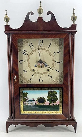 The broken-arch pillar and scroll shelf or mantel clock is by Eli Terry & Sons of Plymouth, Connecticut. The E. Terry & Sons label was printed by Goodwin & Company, dating the clock to 1830 or later. The clock door features an ivory kite escutcheon and retains its lock and key. The glass panel is reverse painted with a residential scene and an oval pendulum window. The dial is painted with Arabic numerals and decorated with an overflowing basket of flowers. The finials are brass. The weights and pulley caps appear to be original. The clock has not been tested. It sold for $1469.