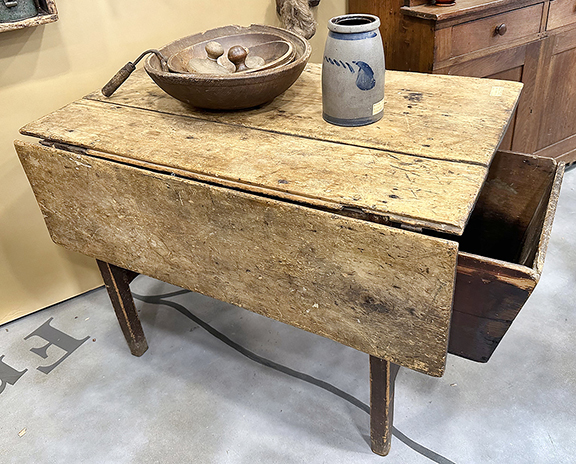 Dough table from Virginia, the single drop leaf with a gate leg, the suspended dough box (seen at the right end of the table) designed to slide out on rails, Spanish brown paint on the base, square legs, H-stretcher, 29½