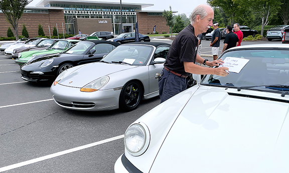  By 8:30 a.m. on September 9, several members of the Triangle chapter of the Porsche Club of America had lined up for a show in the Leland Little Auctions parking lot. By noon all had left as a rainstorm drenched the area. Prunkl photo.