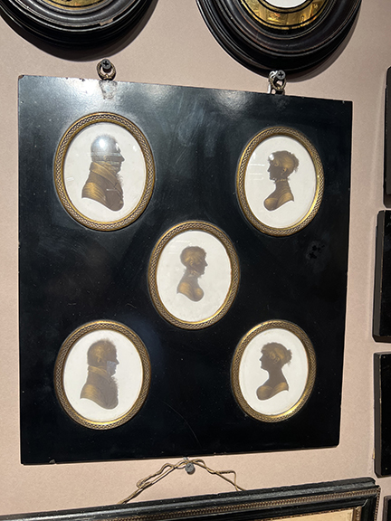 The set of five late 18th-/early 19th-century silhouettes painted on plaster by British artist John Miers (1758-1821) was $1450 from Joy Hanes of Hanes & Ruskin Antiques, Niantic, Connecticut. What made it special, Hanes said, is that the reverse has a Miers label, identifies the sitters, and has some family history.