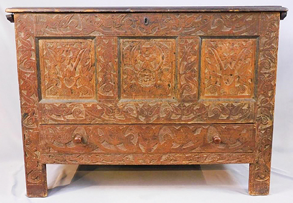 Known as “the Noble chest,” this early 18th-century Hadley chest carved with vines, tulips, and hearts, with three recessed panels on the façade and the initials “TN” on the top rail, was likely made for Thankful Noble, born May 31, 1714, to Thomas and Elizabeth Dewey Noble of Westhampton, Massachusetts, and a cousin of Mary Noble. Estimated at $4000/6000, it realized $10,200. The chest was found in 1920 in Westhampton with only its top compartment. It was restored and purchased by Frederick W. Fuessenich of Torrington, Connecticut. It was acquired later from a Mrs. Andrews in Ashaway, Rhode Island, by the consignor. A letter about the chest from the buyers, dealers Annice Rockwell and her father, Edward Bradley, revealed that it is headed to a 1703 house in Southampton, Massachusetts, only five miles from where Thankful Noble kept it. The chest is illustrated in the 1935 book The Hadley Chest by Clair Franklin Luther; a note from the author accompanied the chest.
