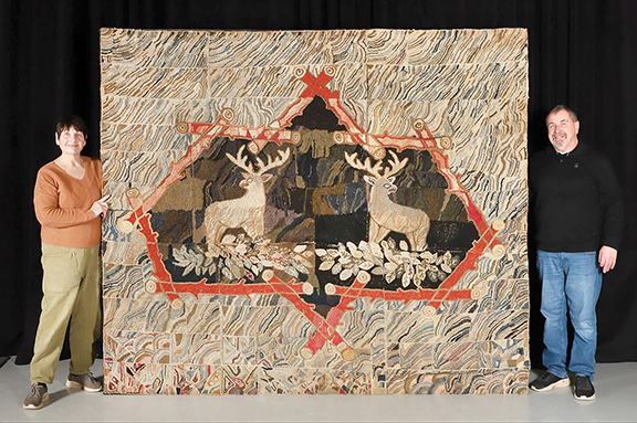 Monumental Adirondack-style hooked rug, 84