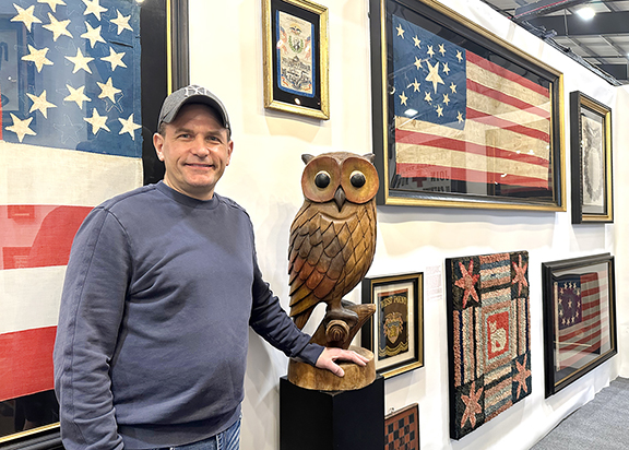Jeff R. Bridgman American Antiques, York County, Pennsylvania, specializes in antique American flags and patriotic textiles, but it was the carved owl figure that Bridgman pointed out. Made of butternut and likely dating to the 1940s or ’50s, it was priced at $9500. He said a smaller example is also known. In the background, the 15-star flag with an unusual star pattern is probably pro-southern, immediately before the Civil War, with the stars representing slave states. The cat hooked rug dates to roughly 1880 to 1910 and was $6500.