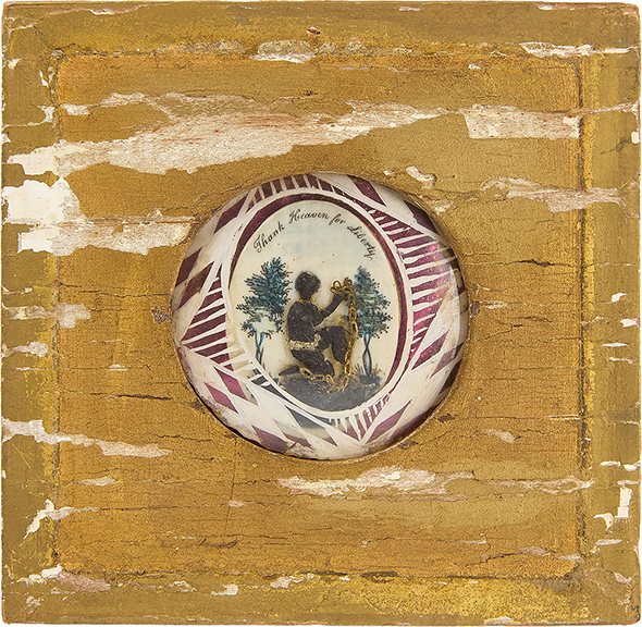 This early abolitionist scene painted on bone depicts a man in chains kneeling below the words “Thank Heaven for Liberty.” The 2