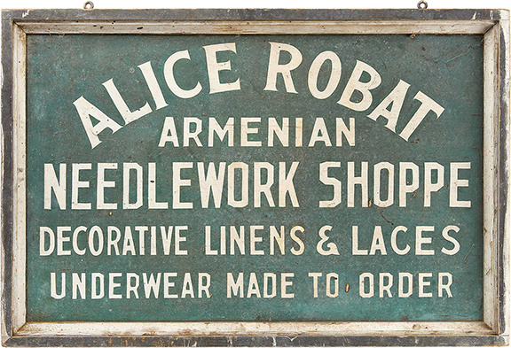 The double-sided painted wood trade sign, 25