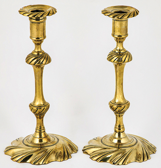 Pair of English Queen Anne brass swirl-base candlesticks, mid-18th century, 10