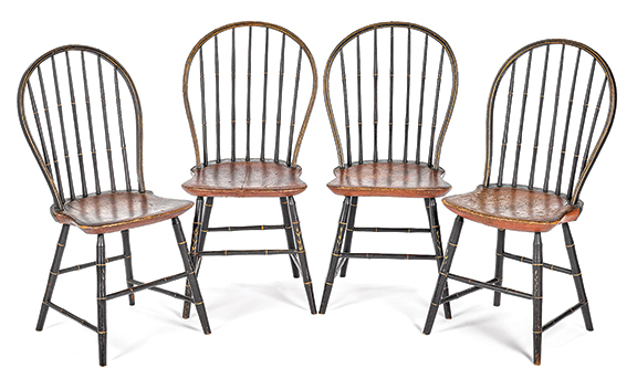 Set of four bow-back Windsor chairs, circa 1820, retaining an old black surface with ocher-grained seats, the undersides initialed “RD,” sold for $2394 (est. $1000/1500).