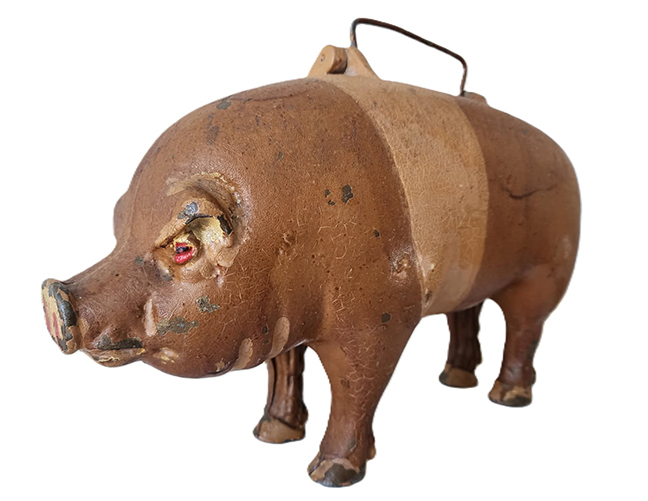 Rare cast-iron pig salesman sample case with its body parts inside showing the works of the body. He used this to promote his product for the pig’s health. Cast inside: Moorman Mfg. Co., Quincy IL. 1885. 15 inches x 9 inches. All original. History available.