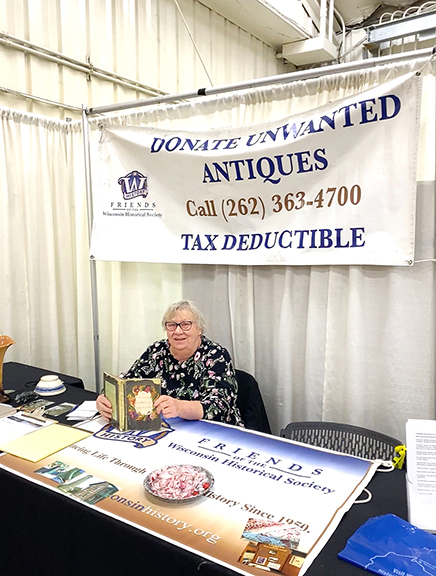 Sandra Fisher, a volunteer with the Wisconsin Historical Society, told us that many attendees ask her what is meant by “unwanted,” as in “DONATE UNWANTED ANTIQUES” stated on the banner behind her. Because she was constantly occupied with curious visitors, we never got to overhear an answer, but we did learn that the organization is all about reaching the public and that it sponsors activities such as a trip to northern Wisconsin by way of LaCrosse.