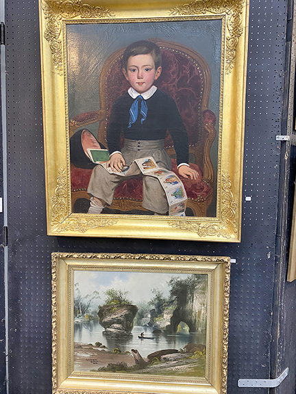 From a Milwaukee estate, the oil on canvas portrait of a young boy with his toy was $3200 from Ron Christman. The late 19th-century oil on canvas landscape depicting the Wisconsin Dells was $595 from Christman. Note the sumptuous frames. 