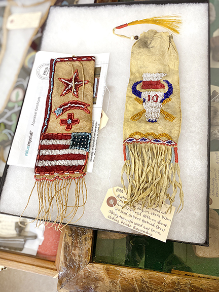 Wisconsin sellers Bill Heuter and Jill Kopatich of Relics & Rarities specialize in prehistoric and early Native American artifacts and antiques. Their display featured a number of historical items, including the Sioux bags shown here. An insurance appraisal shown at left indicates that the item is valued at $8700, but Heuter offered it at $5000. A 2023 online appraisal for the 12