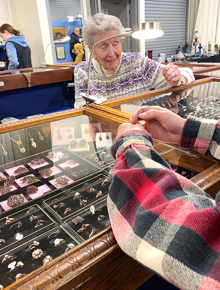 If there is a grande dame of the show, it is surely 91-year-old Pat Olson, who has 67 years in the business. As long as we can remember, the lady from Muskego, Wisconsin, has been seated close to the entry surrounded by chest-level cases packed with a variety of vintage and fine antique jewelry. Here she’s ready to meet and greet with longtime WADA customers who make it a point to stop for a chat.